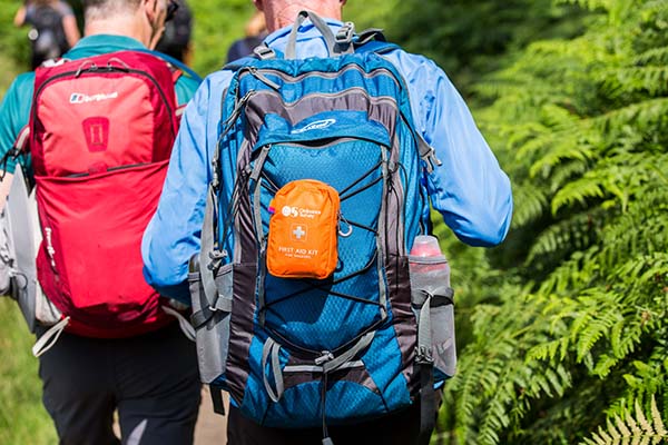 2 men walking with backpacks hiking checklist 
