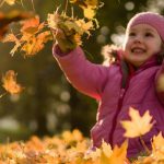 child with leaves