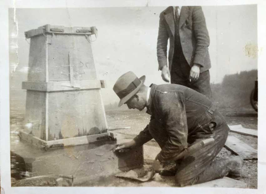Vintage Black & White photo of a trig pillar being constructed