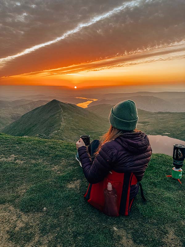 Melissa Jones drinking coffee on a mountain