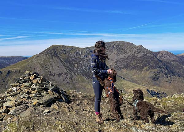 Amy Brook hiking with her cocker spaniels