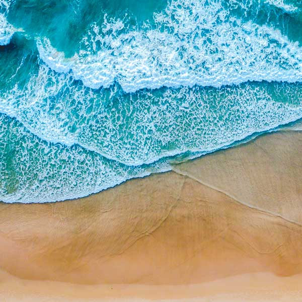 Waves on a beach, overhead view