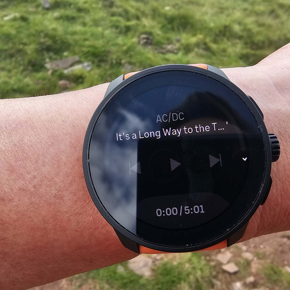 Suunto Race S Watch on wrist showing music app