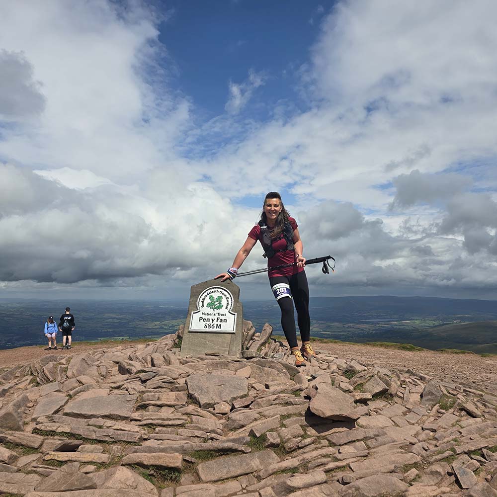 Tracy Purnell running the Beacons Way Ultra at the Pen y Fan summit