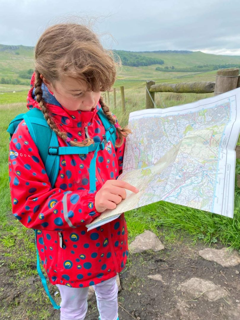 child reading a map emma harrison