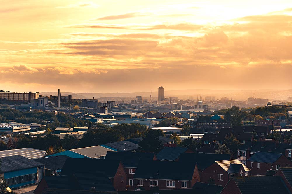 A warm orange sunset behind clouds over Sheffield, South Yorkshi