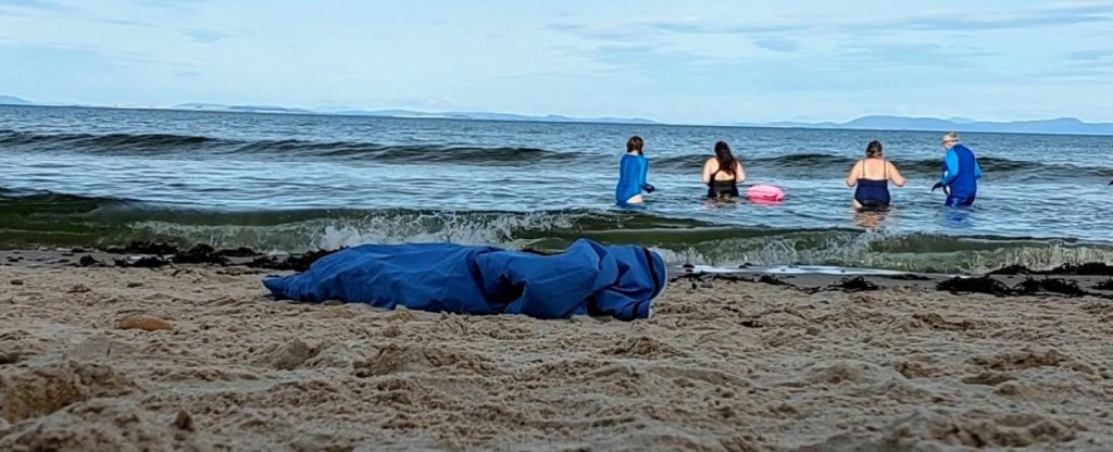 4 women having a wee dook scottish word for a dip in the sea