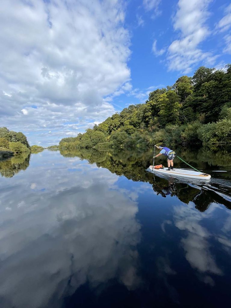 Paddle boarding through trees  on Nottingham Beeston Canal & River Trent photo by Jo Moseley