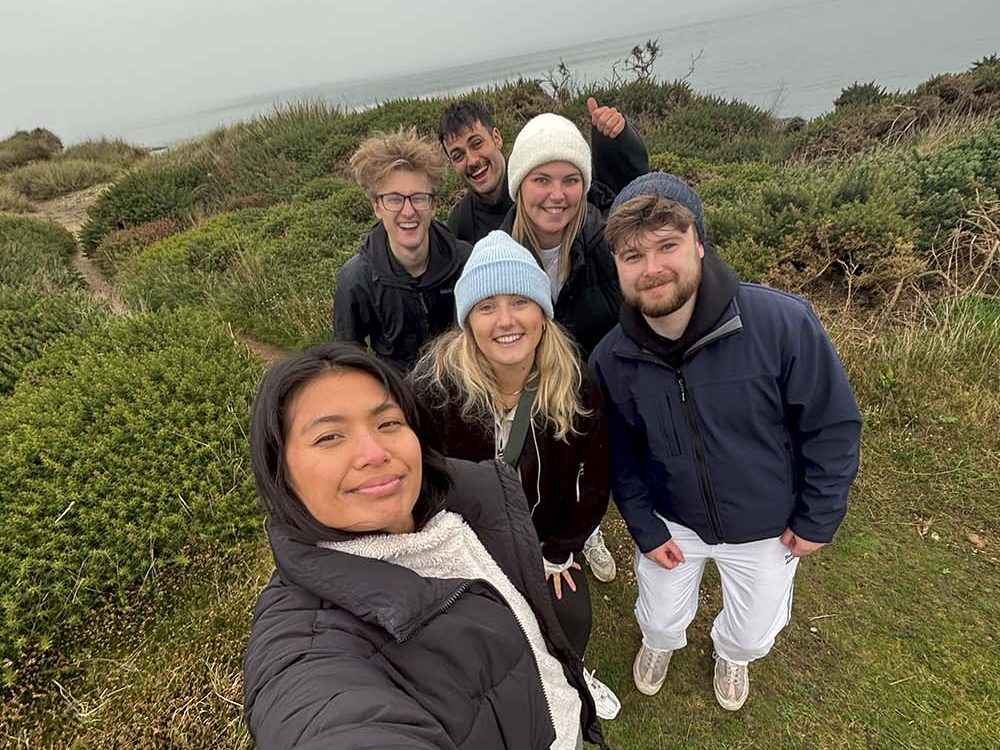 friends taking a selfie outside on a cold day
