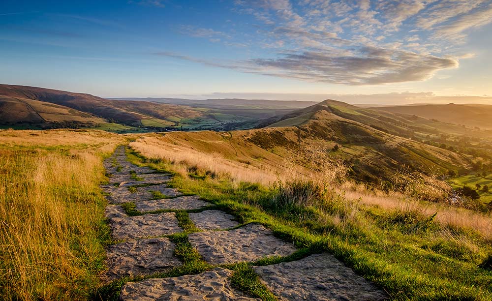 A stone path leading from Mam Tor mountain along the ridge.