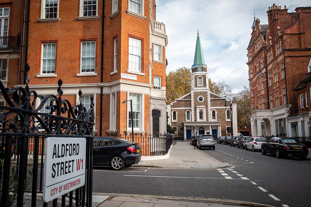 LONDON-  Grosvenor Chapel and beautiful red brick mansion buildi