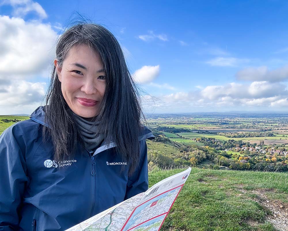 May Cheung with a map