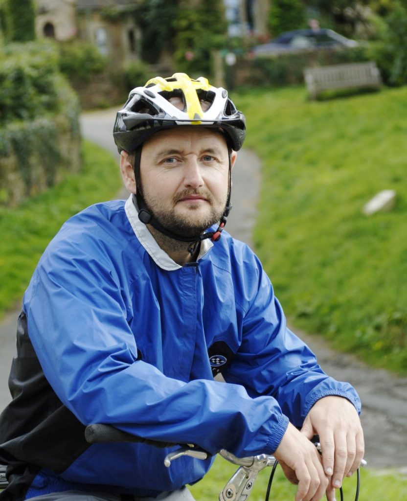 Richard Peace wearing a cycling helmet headshot