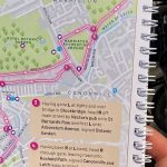 Reading Cycling Guide Book on Bike