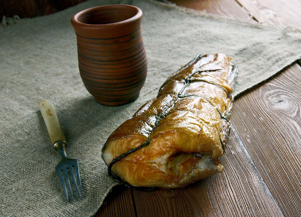 Arbroath Smokie smoked fish with traditional mug and fork