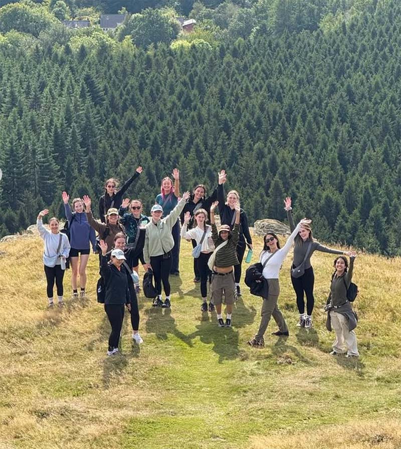 Group standing on top of a hill