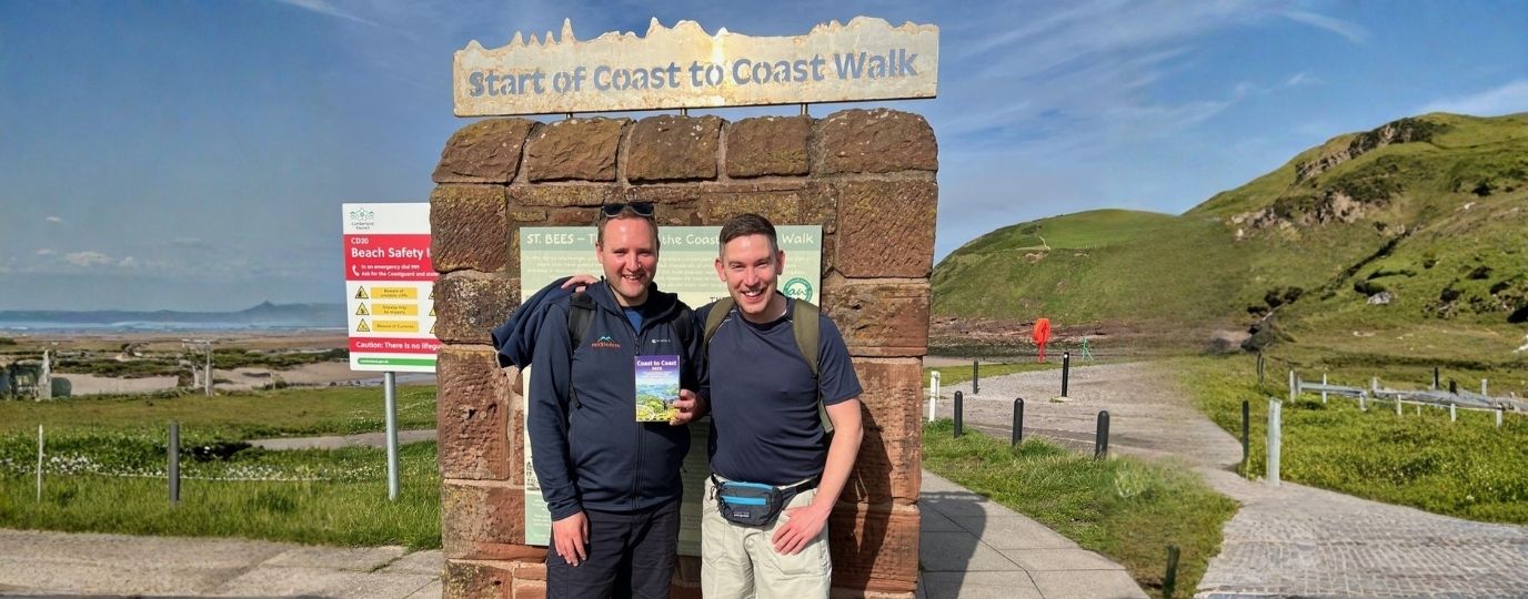 2 men at the start of the coast to coast walk