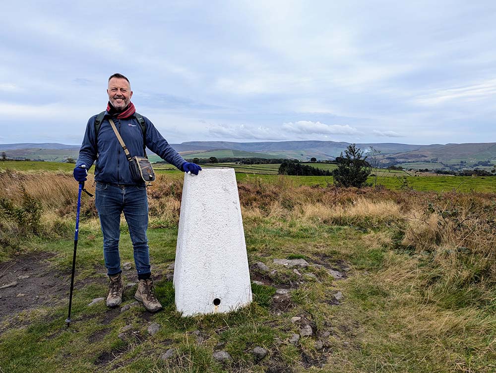 Dr Andrew Read At the Mellor Moor trig point (Walk 21), September 2024
