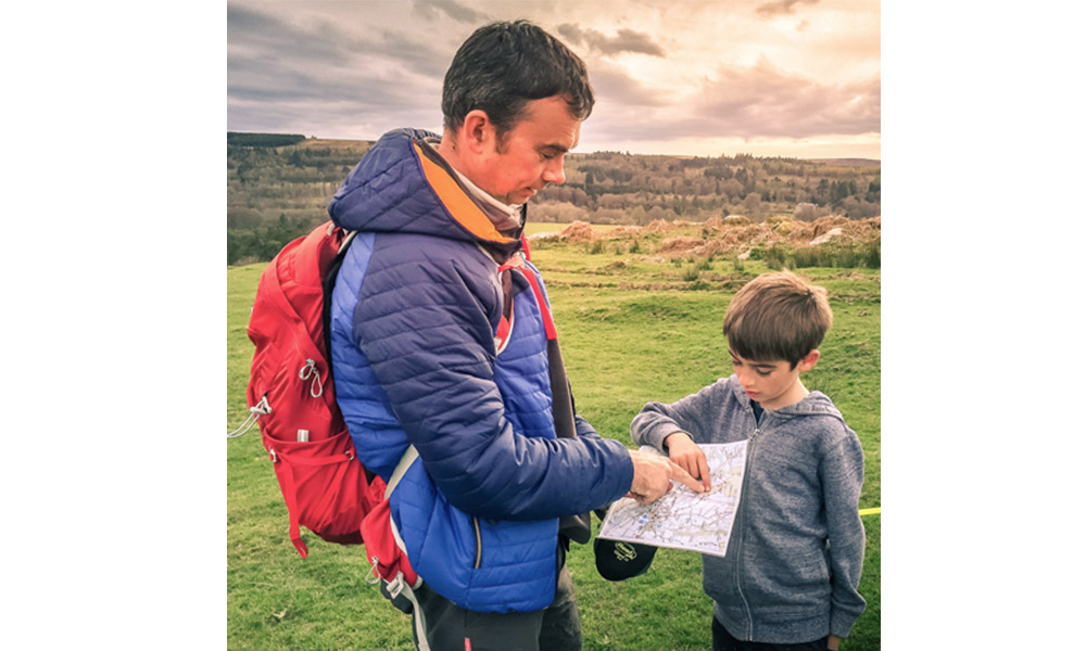 father and son map reading 