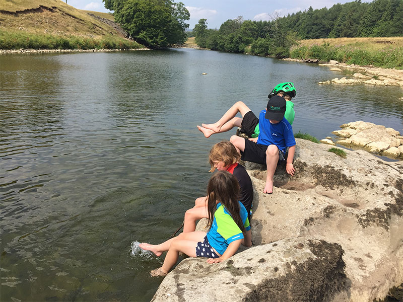 Kids mucking around in the river