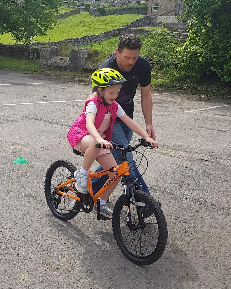 Teaching a child to ride a bike
