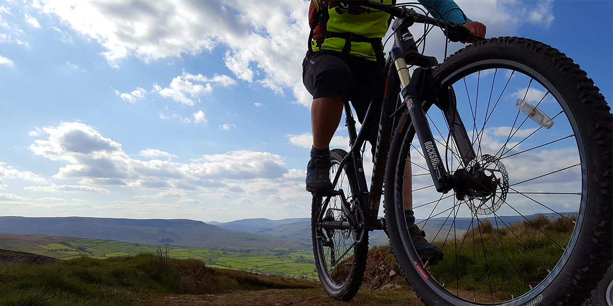 Close-up of mountain biker in the countryside