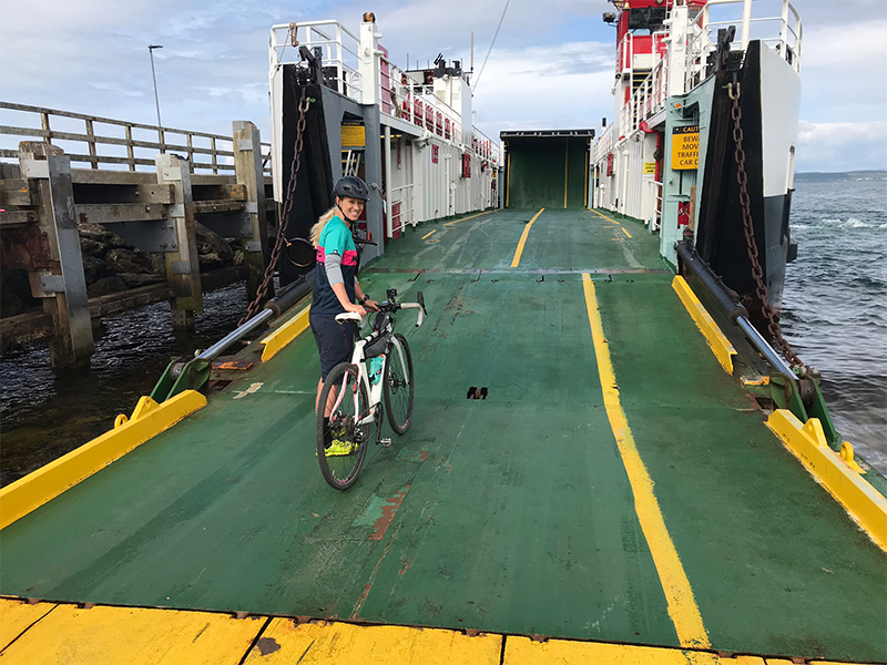 Nicole getting on ferry with her bike