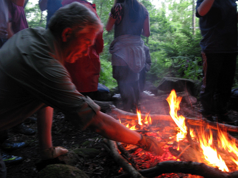 Nigel tending a fire