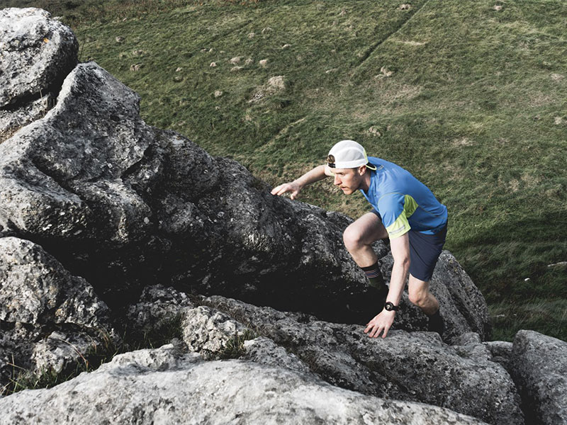 Rory scrambling up limestone bolders
