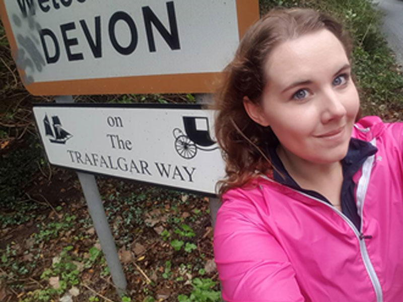 Kate by the Trafalgar Way sign